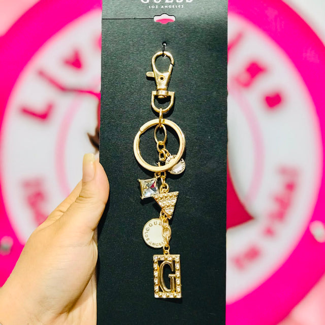 Llavero Guess Los Ángeles Dorado con Charms.