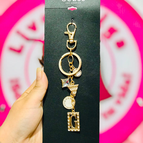 Llavero Guess Los Ángeles Dorado con Charms.